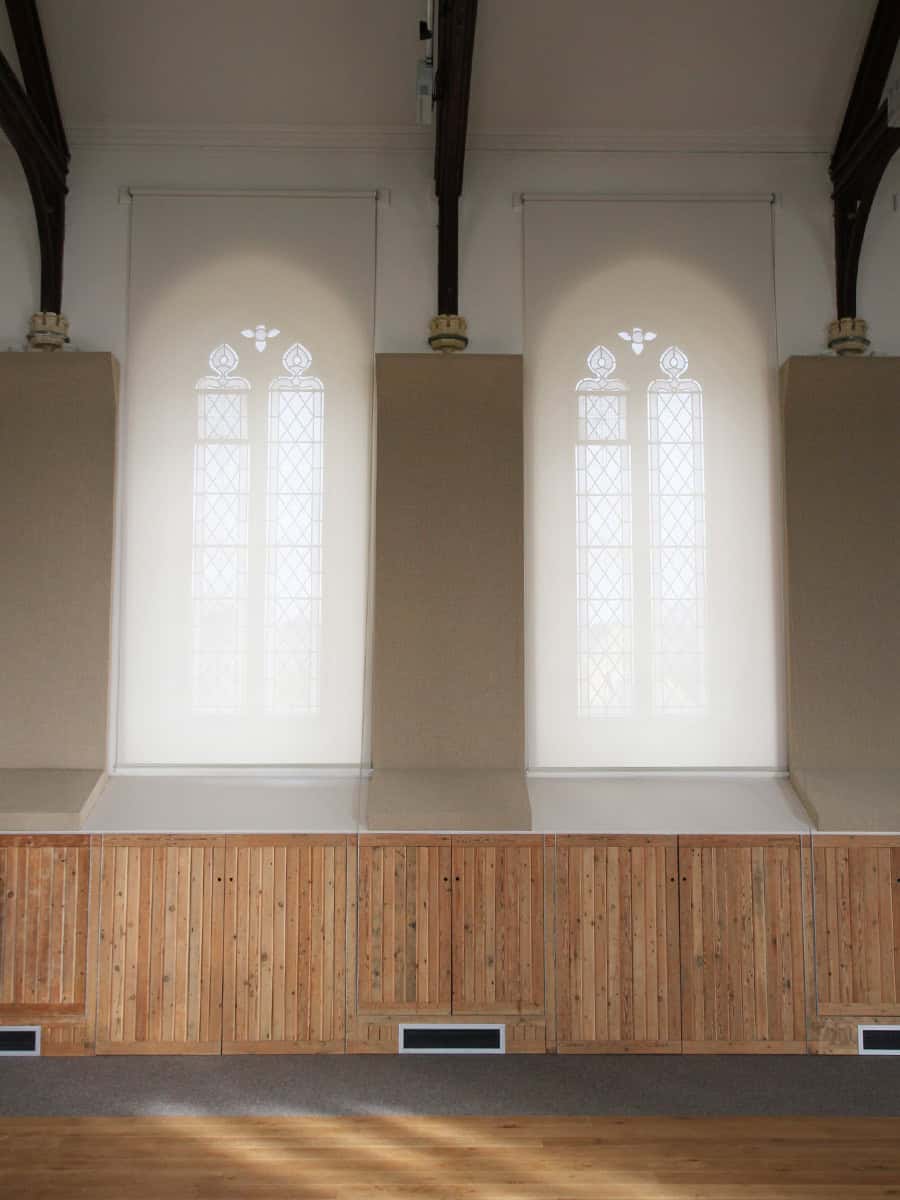Horsley Church Gothic lancet windows with acoustic panels, timber dado and dark roof trusses